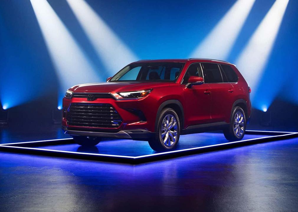 A red 2025 Toyota Highlander as displayed for the Edmunds 2025 Top Rated Awards.