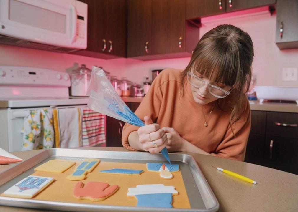 Kitchen Founder Emily Henegar icing custom cookies.