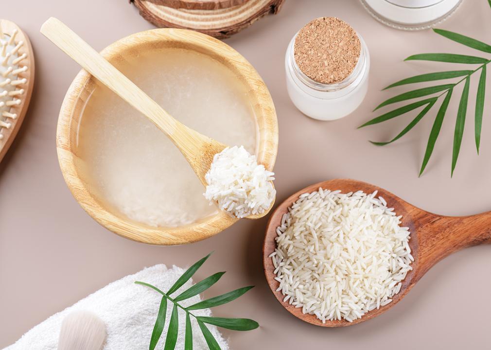 A scoop and bowl of soaked rice for wellness purposes.