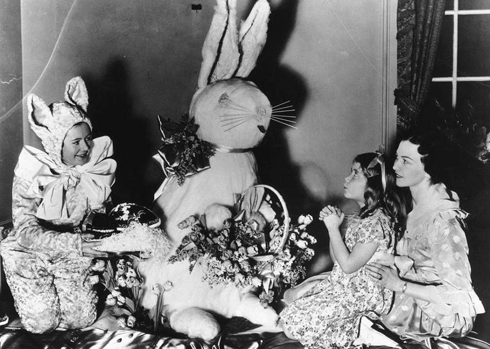 Historical photo of young girl praying to Easter Bunny in New York in 1936.