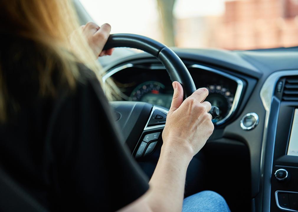 A woman driving a car.