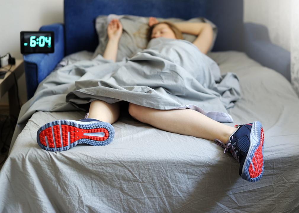 A woman who got ready for a fitness training goes back to bed.