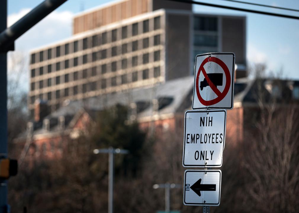 A sign that reads "NIH Employees Only" near an entrance at the National Institute of Health in Bethesda, Maryland.