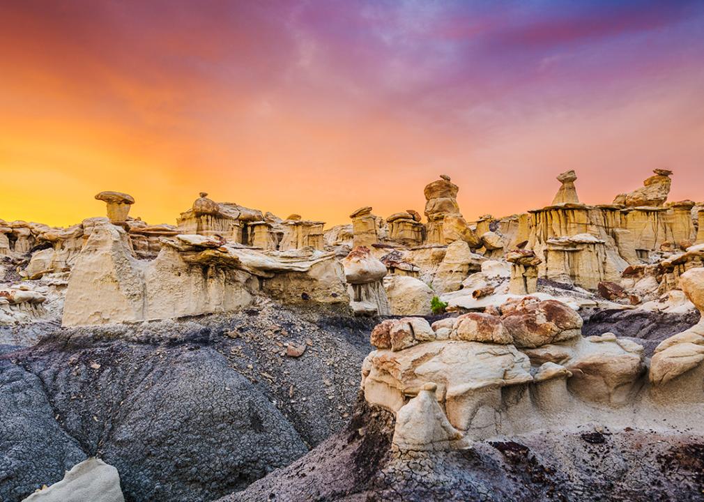 The Bisti/De-Na-Zin Wilderness in New Mexico during sunset.