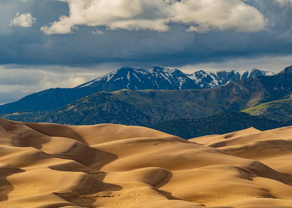 A sunny view of the Great Sand Dunes landscape at the National Park and Preserve in Colorado.