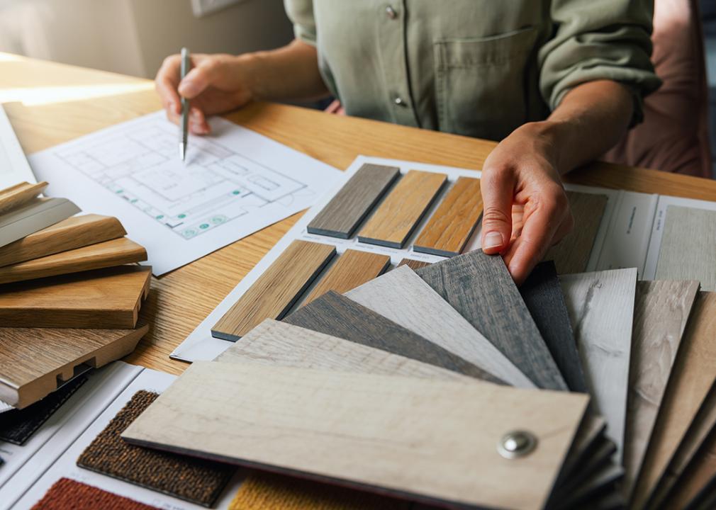 Interior designer looking at furniture materials and design options.