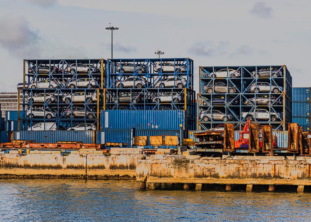 Port Miami with imported cars stacked in metal containers.