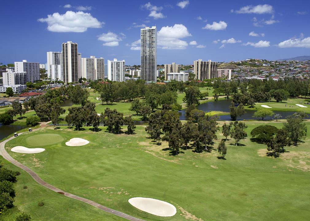 A golf course with condominium buildings overlooking in Hawaii.