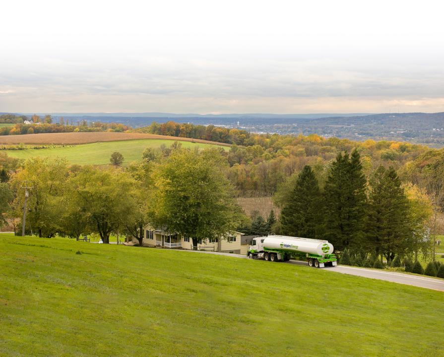 A tank truck driving on a highway.