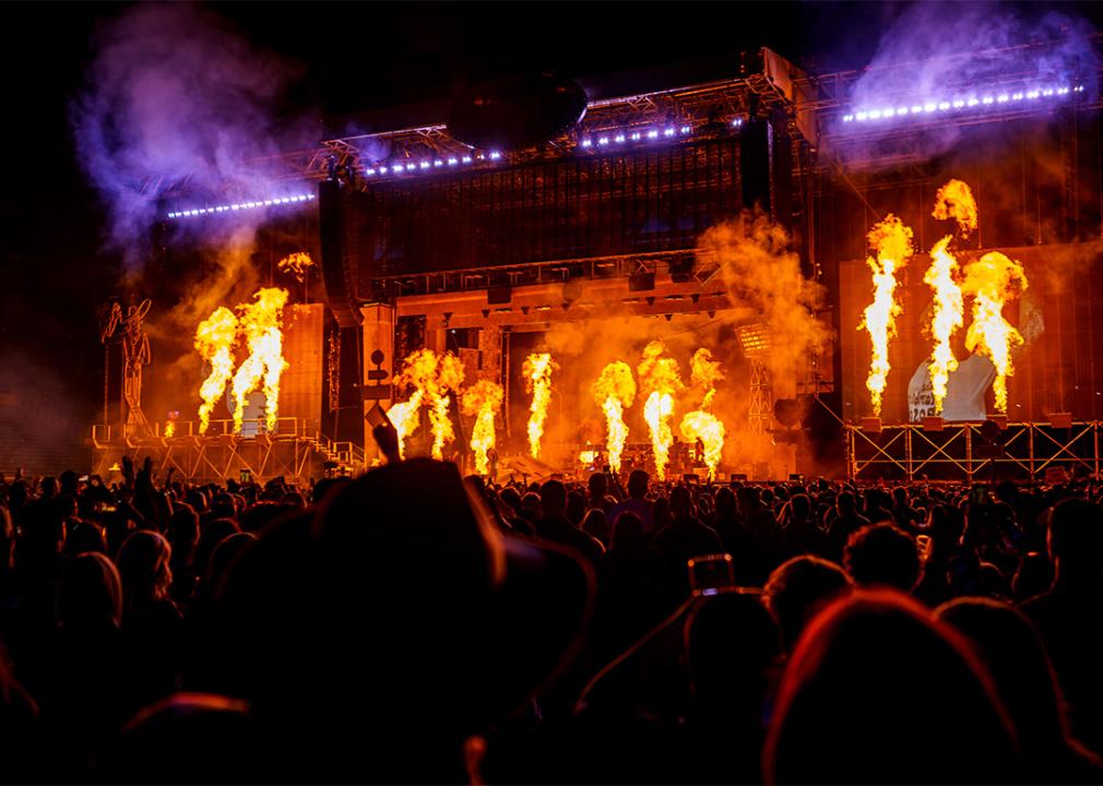 A view of the crowd and Post Malone's fiery stage at Rice-Eccles Stadium.