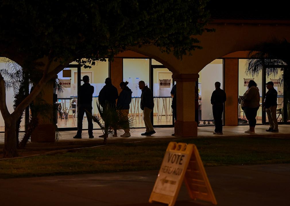 Voters wait in line at a polling station at the Guadalupe Mercado shopping mall in Guadalupe, Arizona.