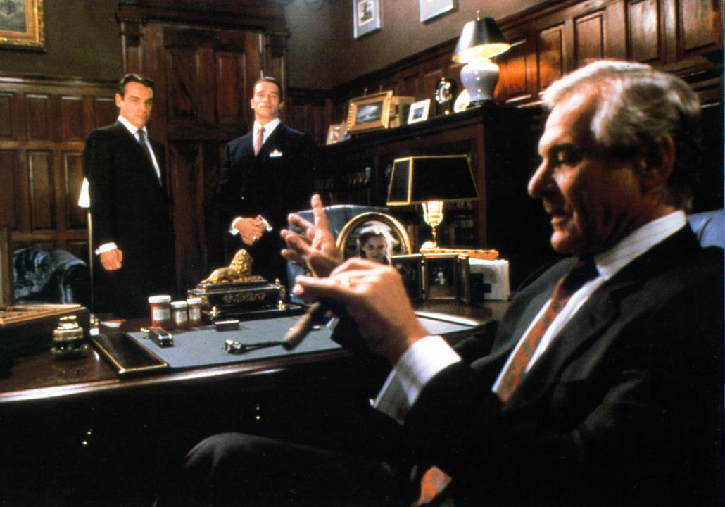 #32. Raw Deal (1986) Arnold Schwarzenegger meets with a man in a scene from the film 'Raw Deal', 1986.