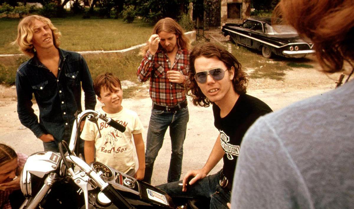 35 photos that show what life looked like in 1973 Friends standing around a guy on a motorcycle