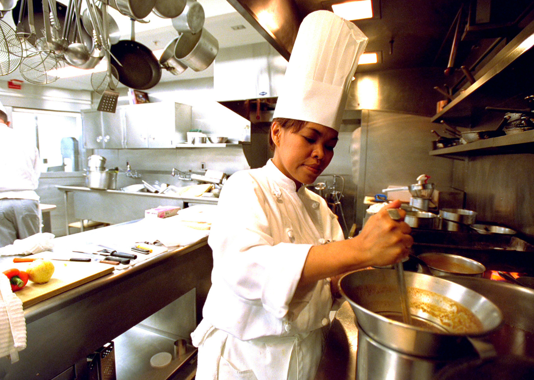 Cristeta Comerford prepares a meal inside the White House kitchen.