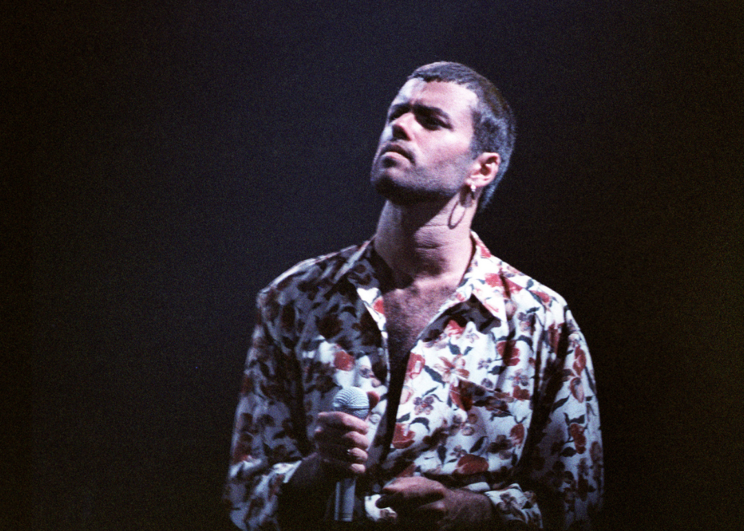 George Michael performing on stage.