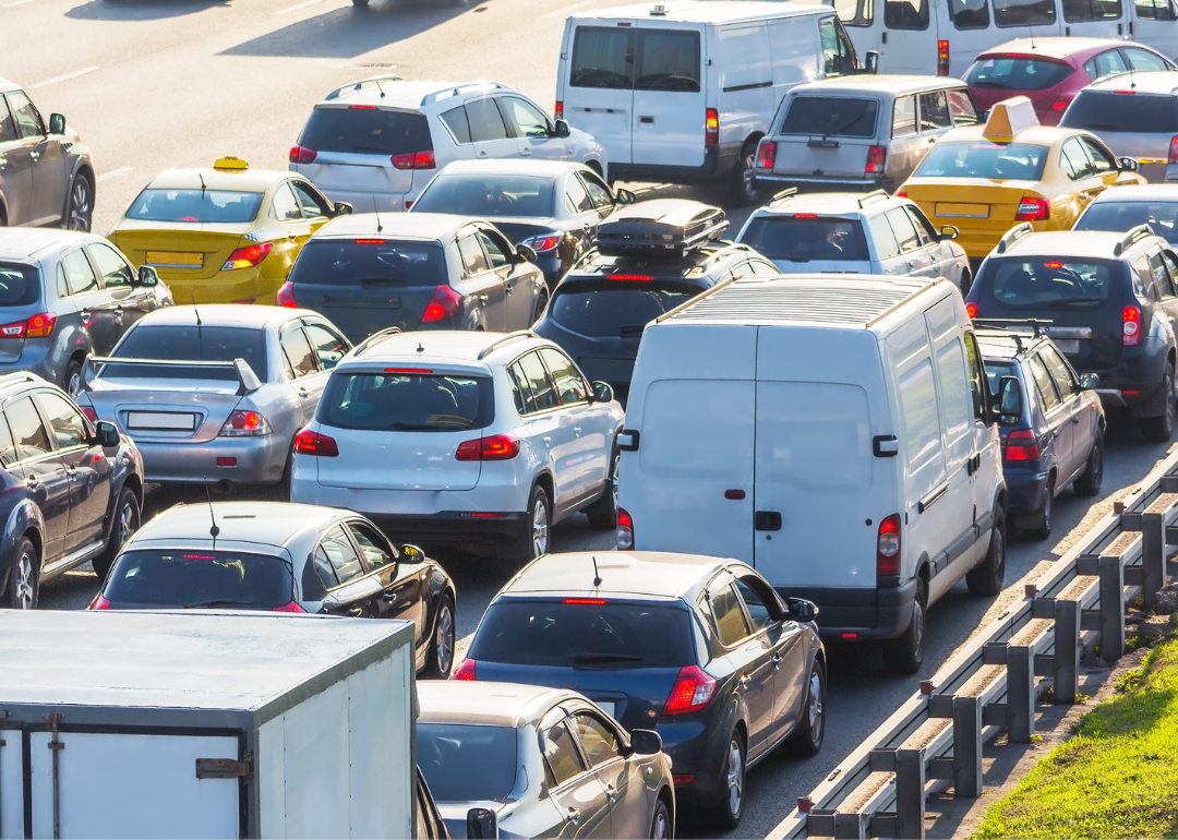 Cars stopped in traffic on highway.