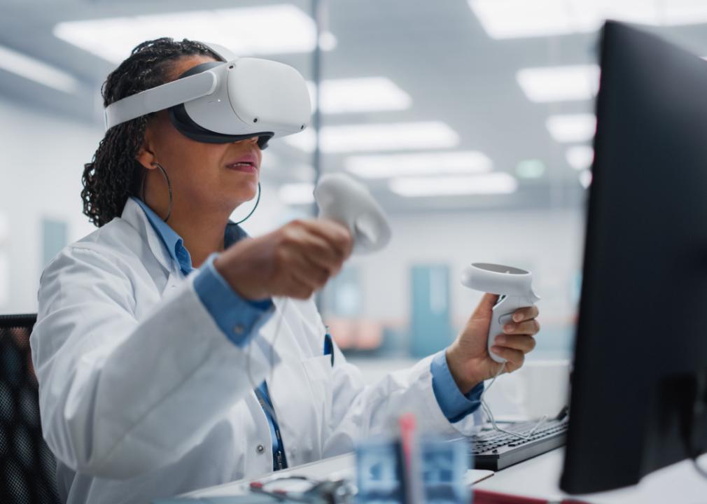 Surgeon using VR headset to train.