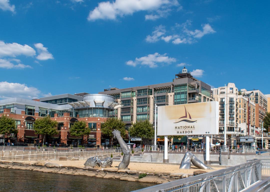 Sign and buildings at National Harbor pier.