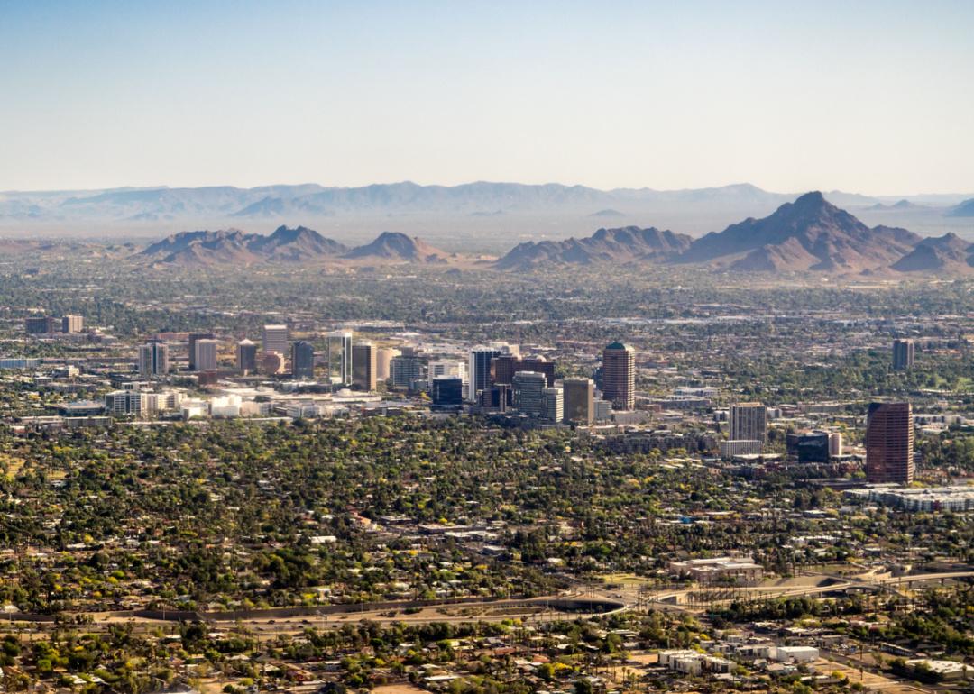 Arial view cityscape and mountains.