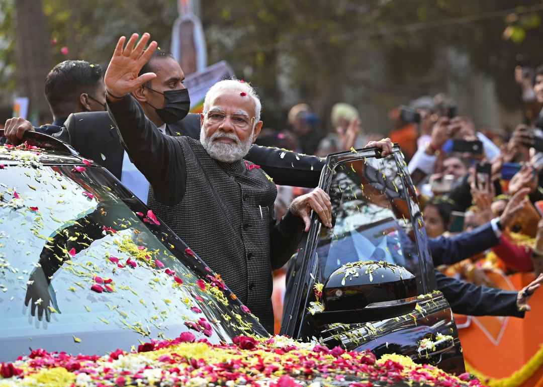 Prime Minister Narendra Modi waves to his supporters in Delhi.