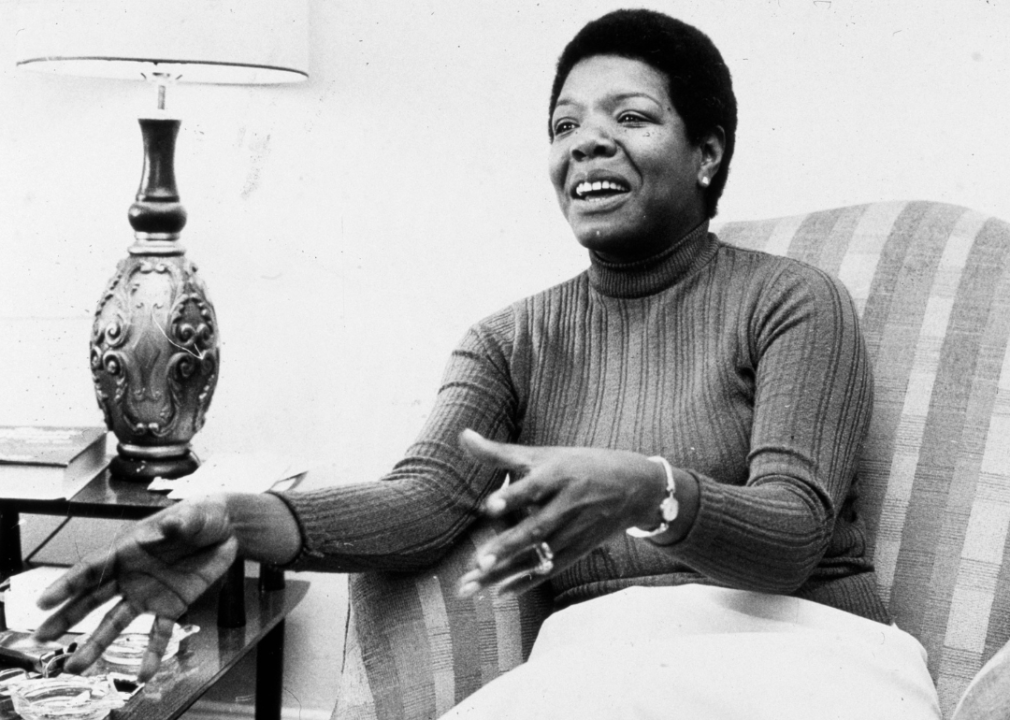Maya Angelou gestures while speaking in a chair during an interview.