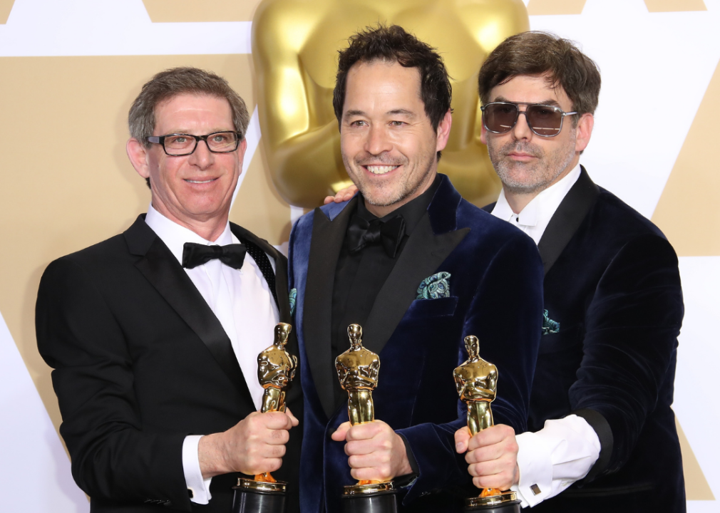 Jeffrey A. Melvin, Paul Denham Austerberry and Shane Vieau pose with their Oscars
