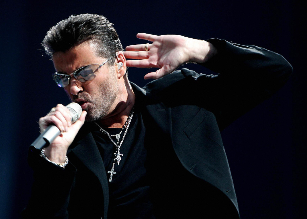 George Michael performing on stage.