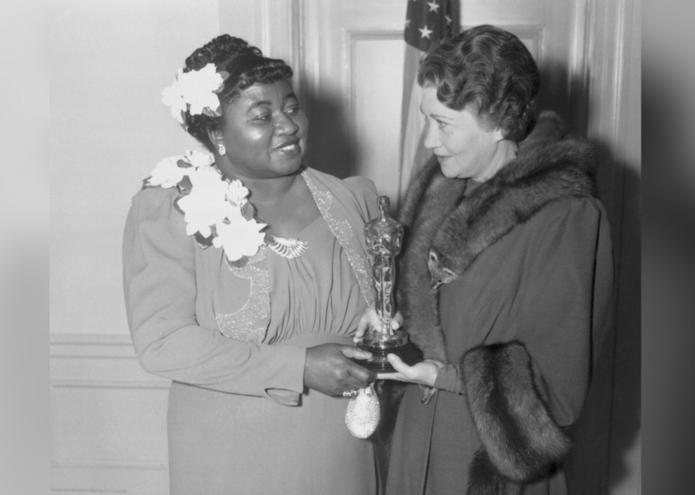 Actress Fay Bainter (at right) presents Hattie McDaniel with the Oscar for her supporting role in "Gone With the Wind" on Feb. 29, 1940.