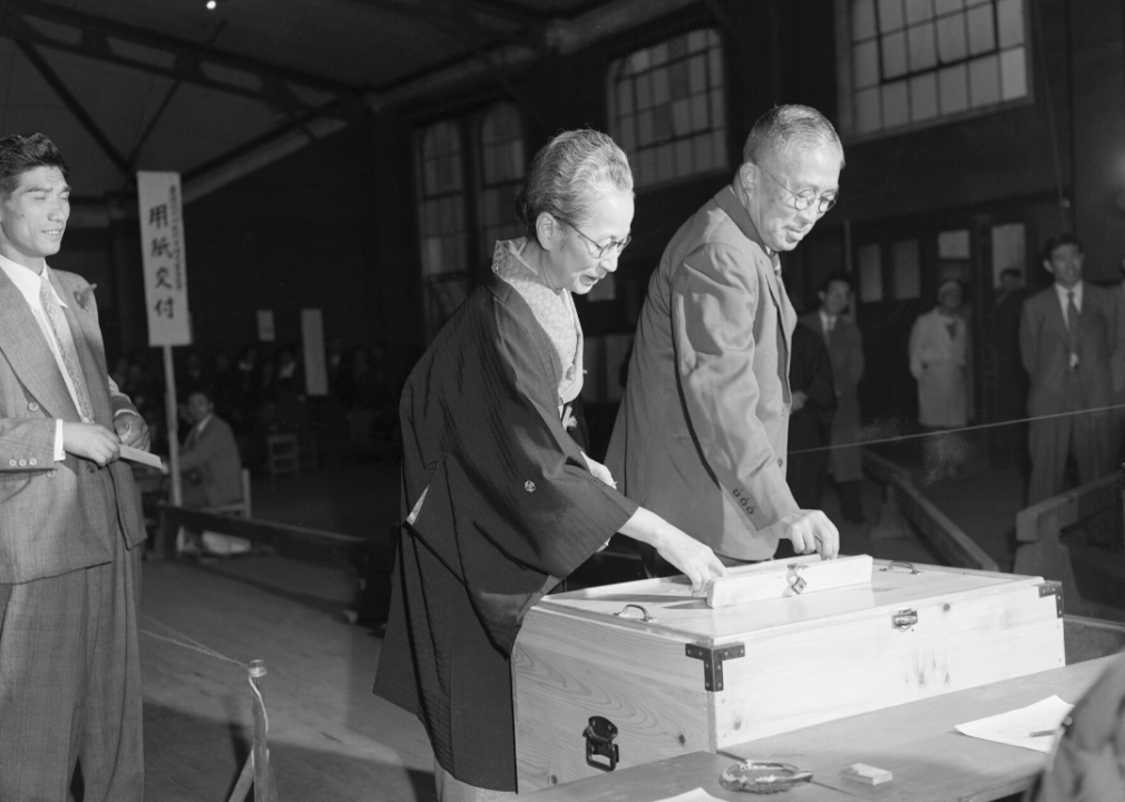 Hatoyama Ichiro, former head of the pro-American Liberal Party, is shown with his wife as they cast their ballots in Japan's National Election in 1952