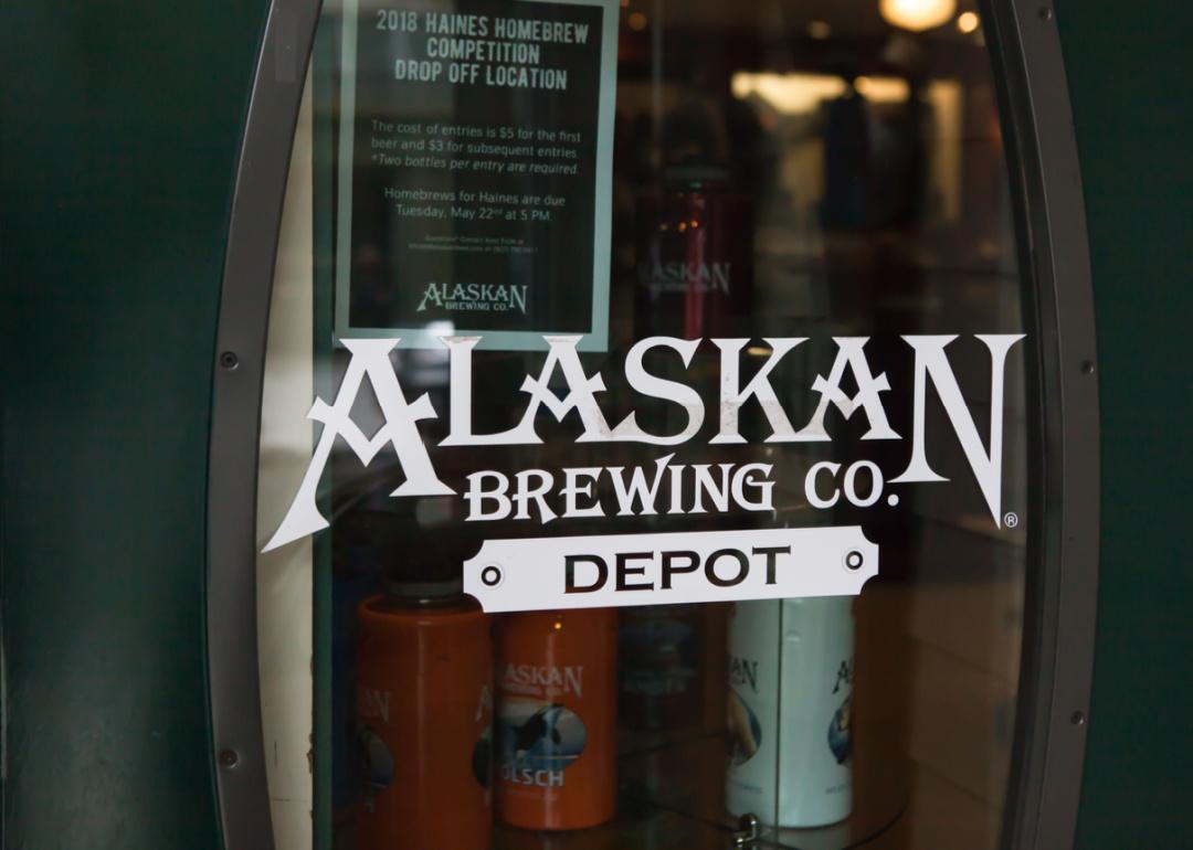 #28. Alaska Alaska Brewing Company Depot logo on glass door.