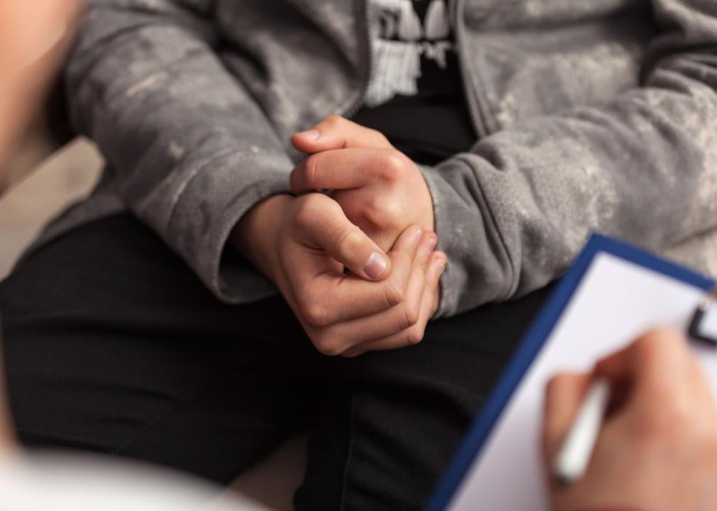 Close up hands of teenager at counseling.