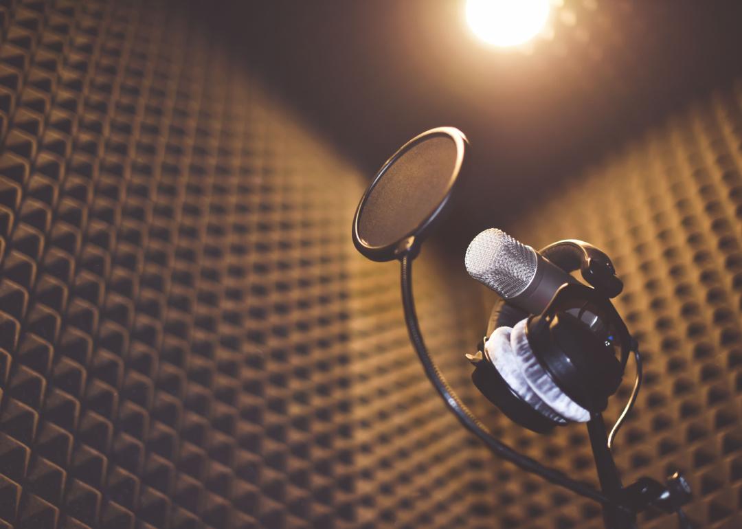 Soundproofed room with recording microphone and headphones.