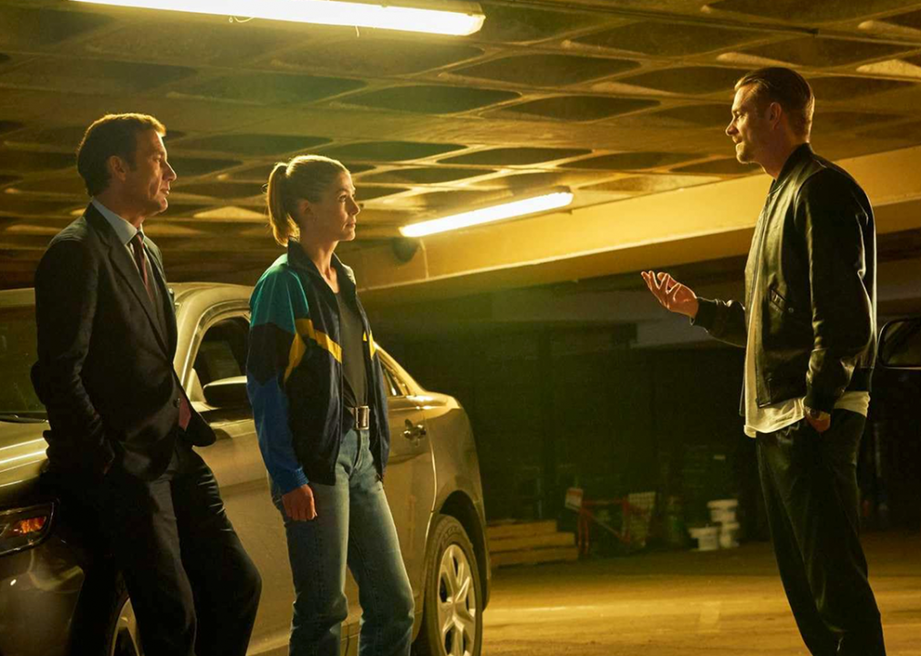 Clive Owen, Rosamund Pike, and Joel Kinnaman in ‘The Informer’.