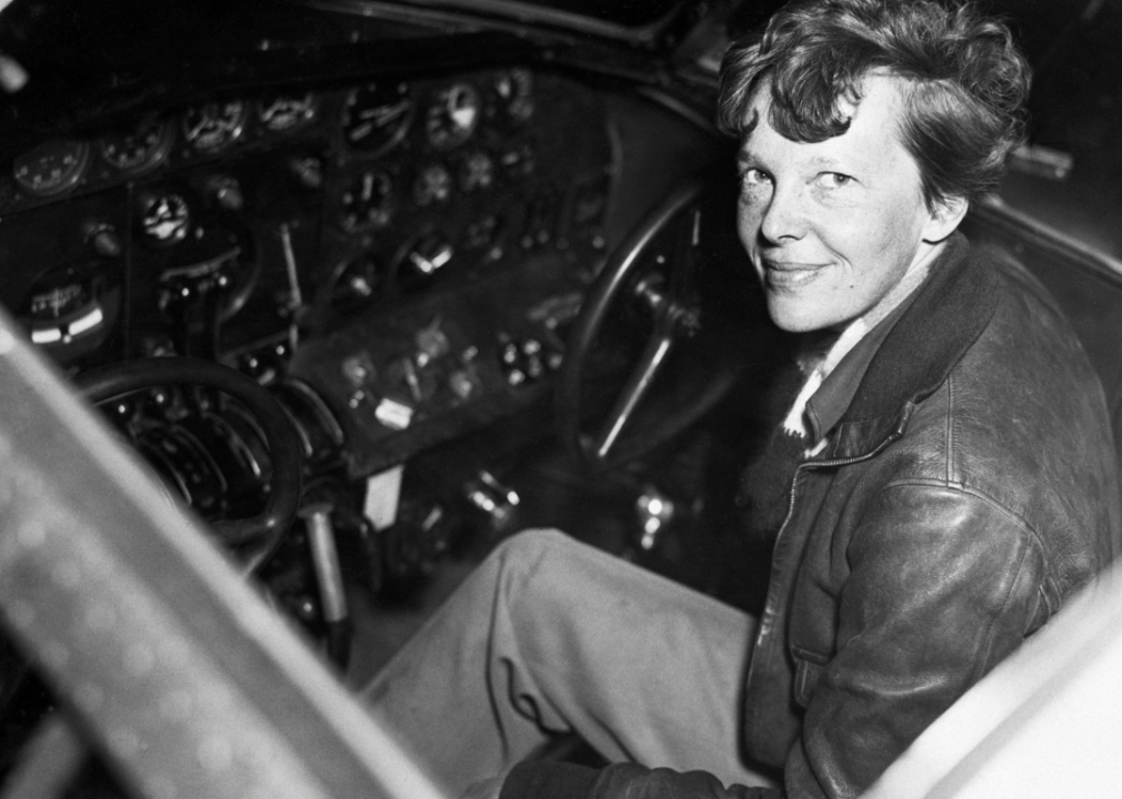 Amelia Earhart siting in cockpit of small plane