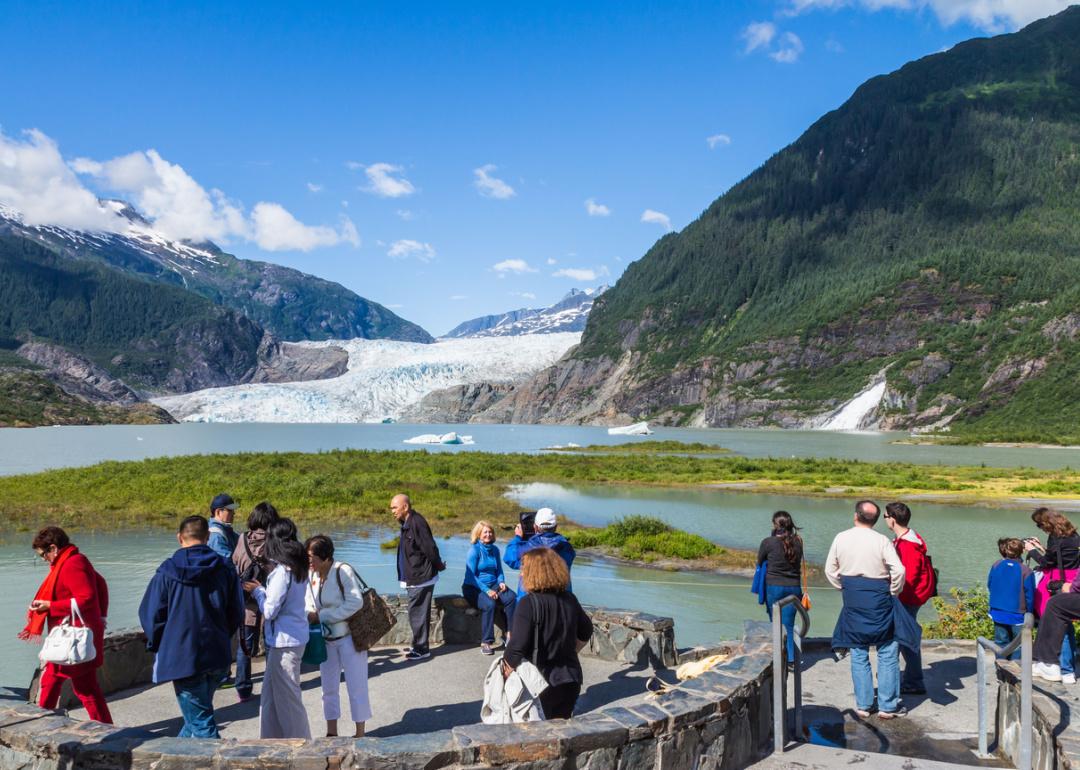 Tourists at Mendenhall Glacier viewpoint.