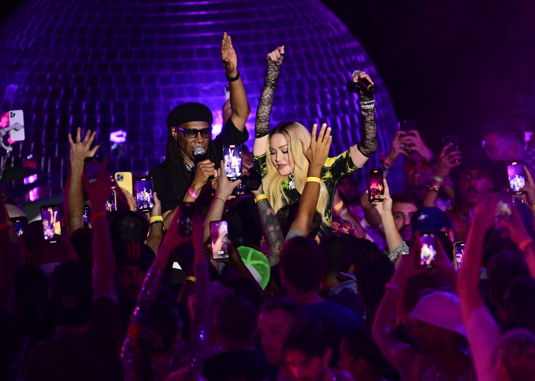 Nile Rodgers and Madonna speak to a crowd at The DiscOasis in Central Park.