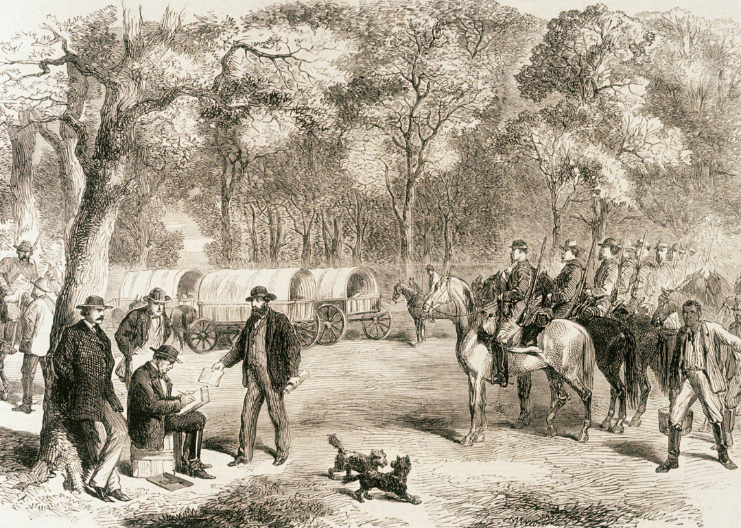 Jefferson Davis signs government papers by the roadside.