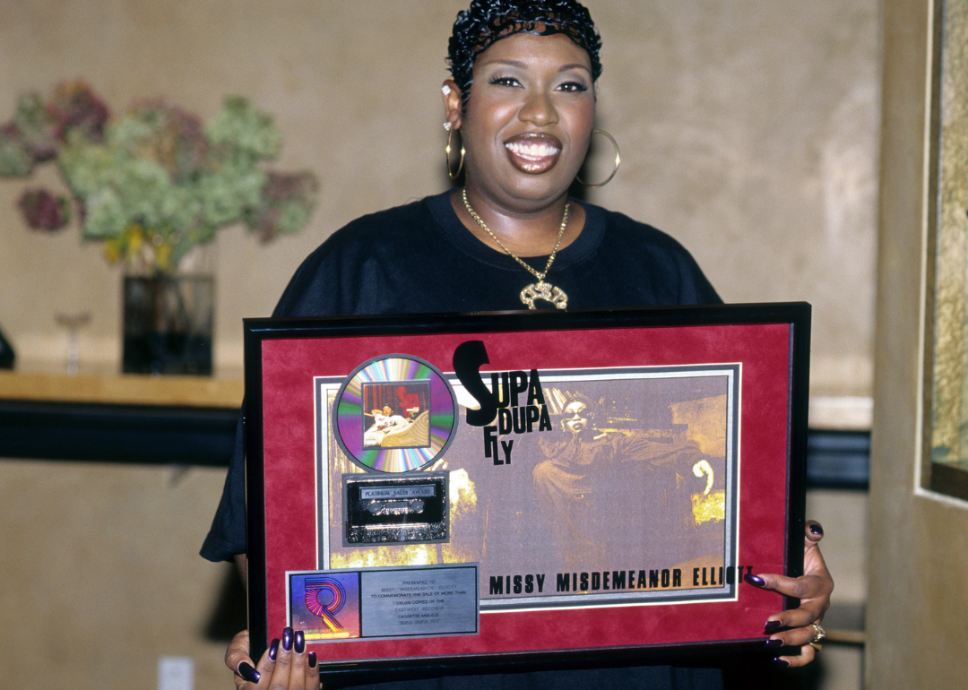 Missy Elliott holds up the Platinum Sales Award for “Supa Dupa Fly”.