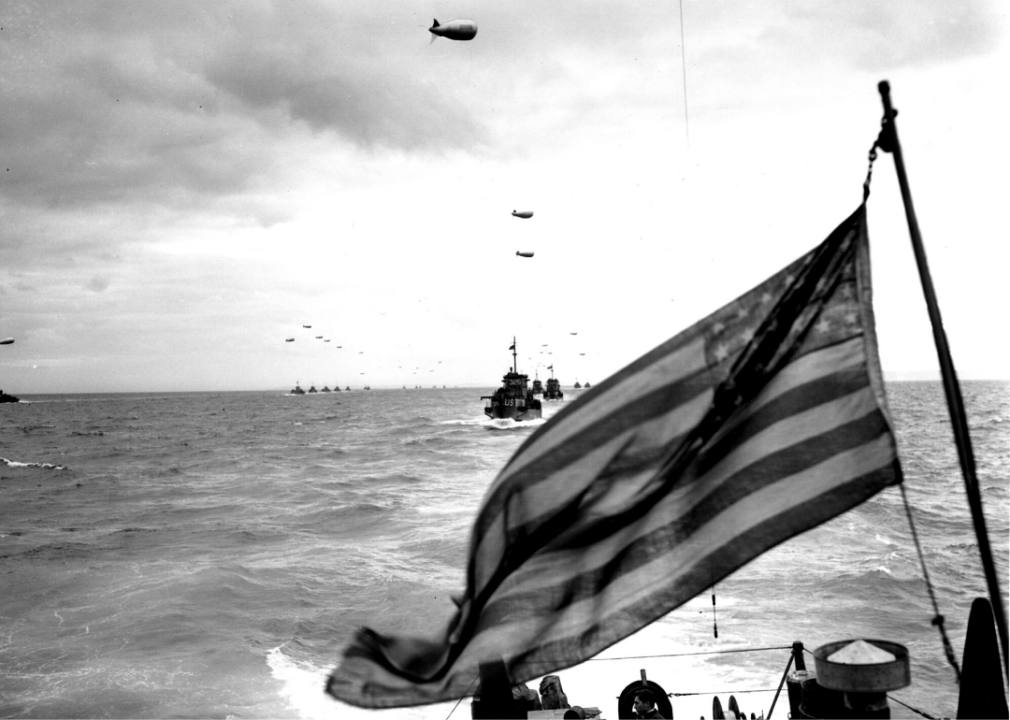 Columns of Coast Guard LCIs protected by barrage balloons advance across the English Channel on June 6, 1944.