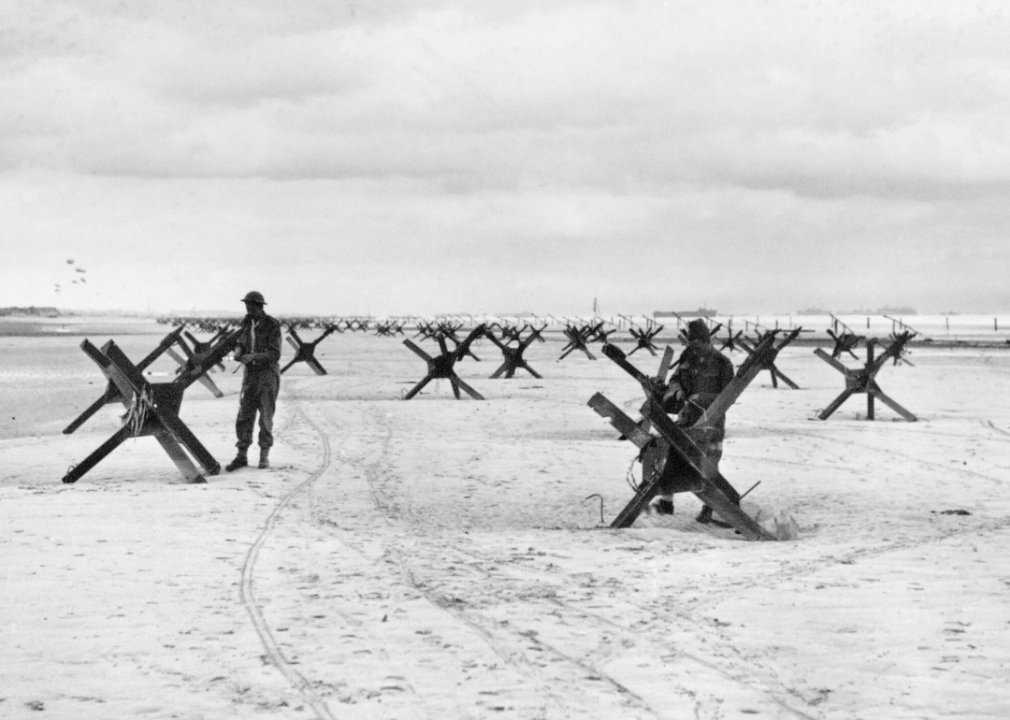 Royal Marine Commandos prepare to demolish German obstacles on a beach in Normandy in June 1944.