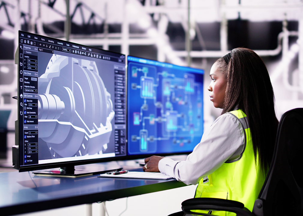 Engineer working on 3D CAD design in factory.