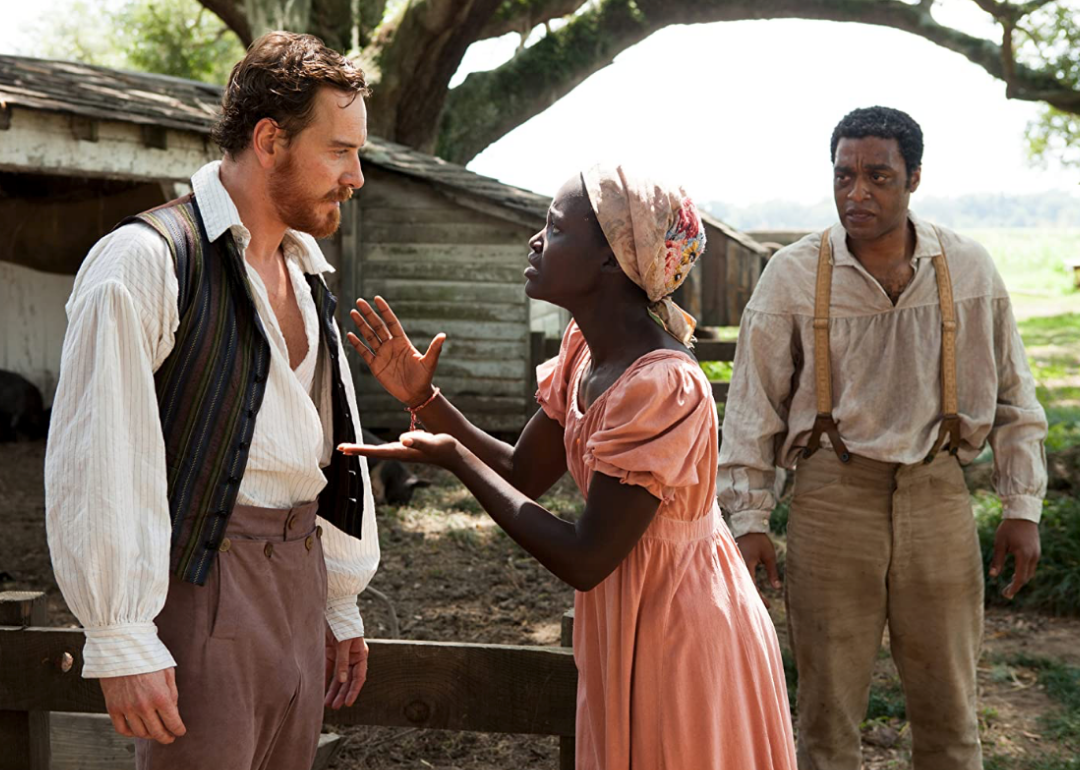 Chiwetel Ejiofor, Michael Fassbender, and Lupita Nyong'o in a scene from ’12 Years a Slave’