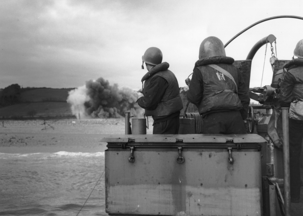 An LCI noses into the beach as a German mine explodes off the bow on June 6, 1944.