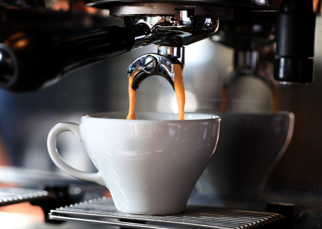 Detail of espresso machine brewing drinks.