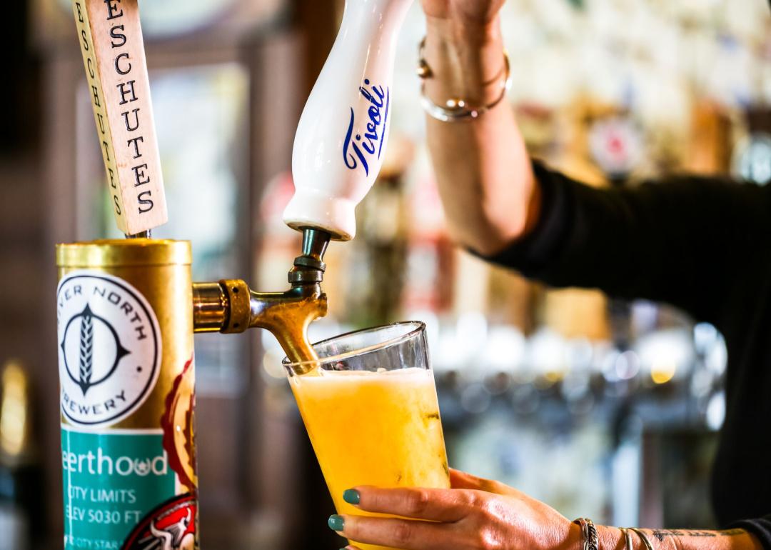 #17. Colorado Bartender pouring draft beer in the bar.