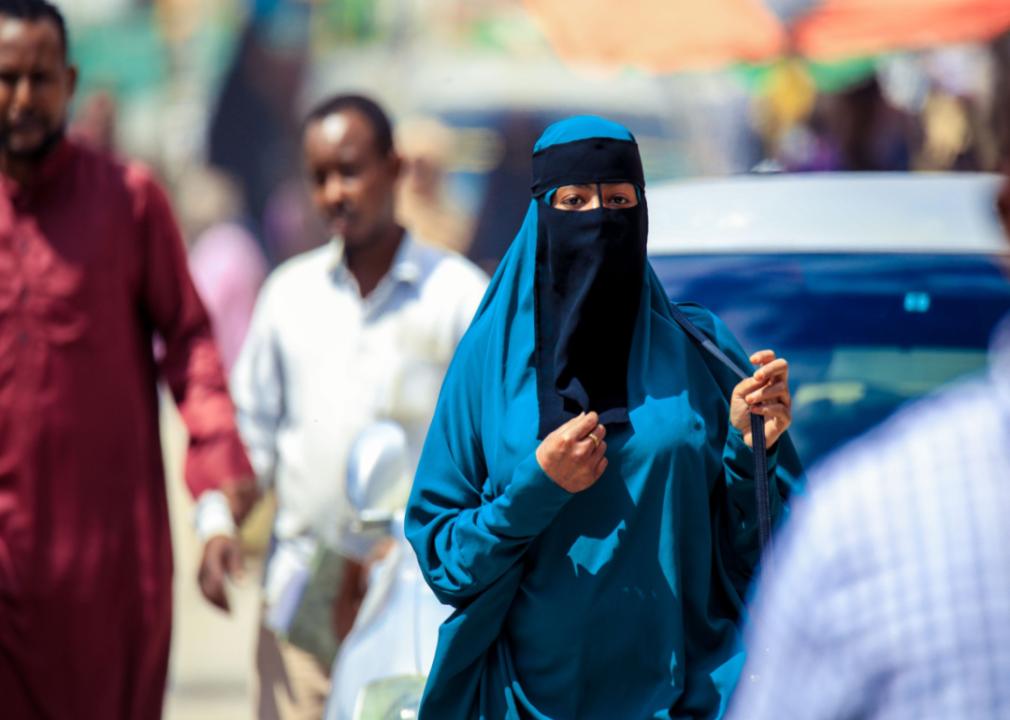 Muslim woman in hijab waking on streets of Hargeisa