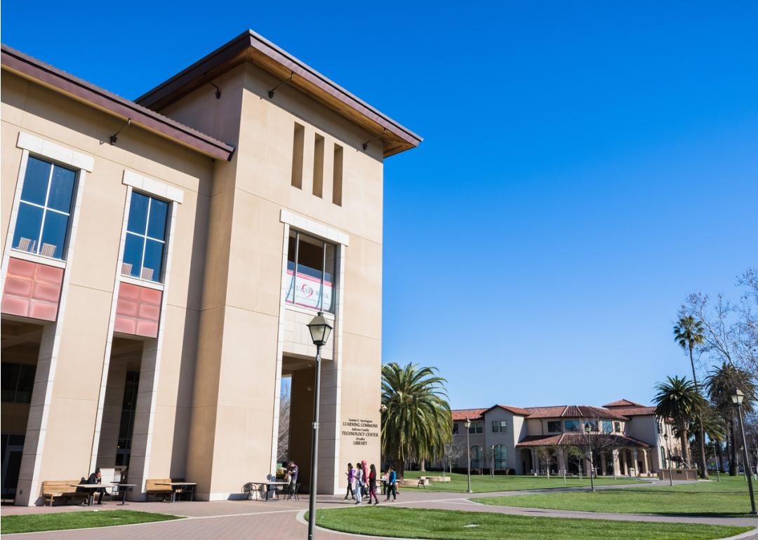 People visit Santa Clara University campus on a sunny day.