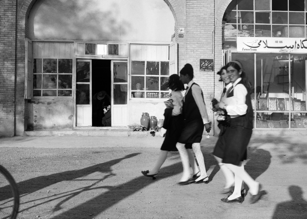 Iranian schoolgirls walk in the streets of Ispahan on May 2, 1968