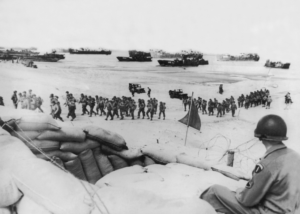 An Allied soldier looks out over the Normandy operations underway on June 6, 1944.