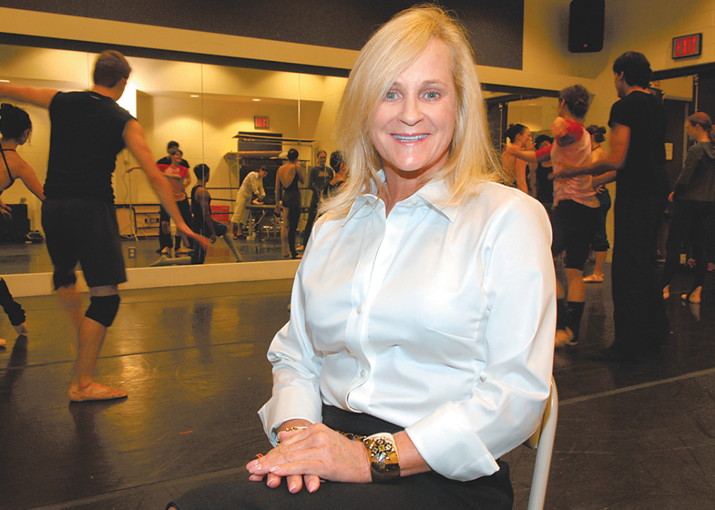 Nancy Walton Laurie poses for a portrait in a dance studio.